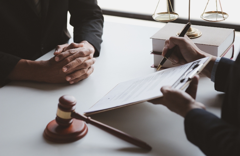 Lawyer is showing documents to the client
